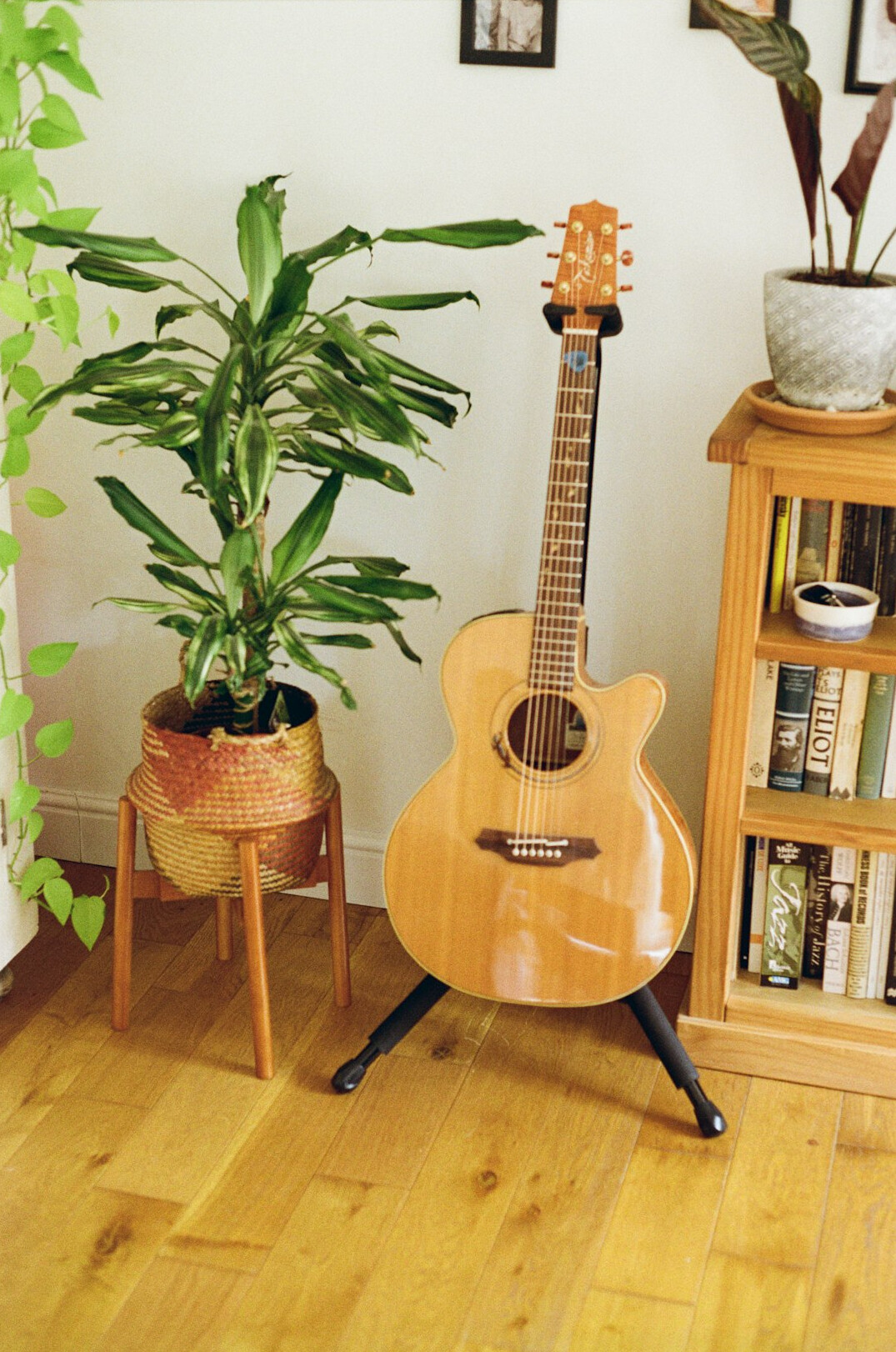 Acoustic guitar and vinyl records in a warm room