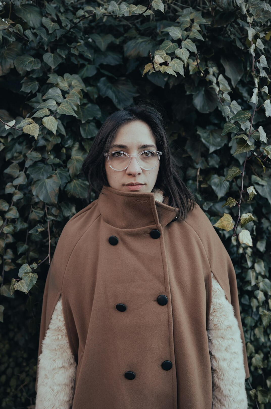 Portrait of a young woman archivist with glasses