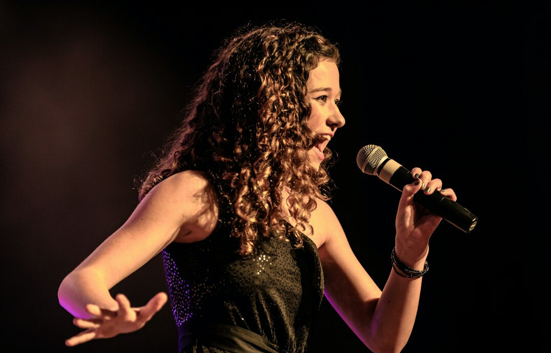 singer performing on stage